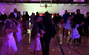 Fathers and daughters dancing